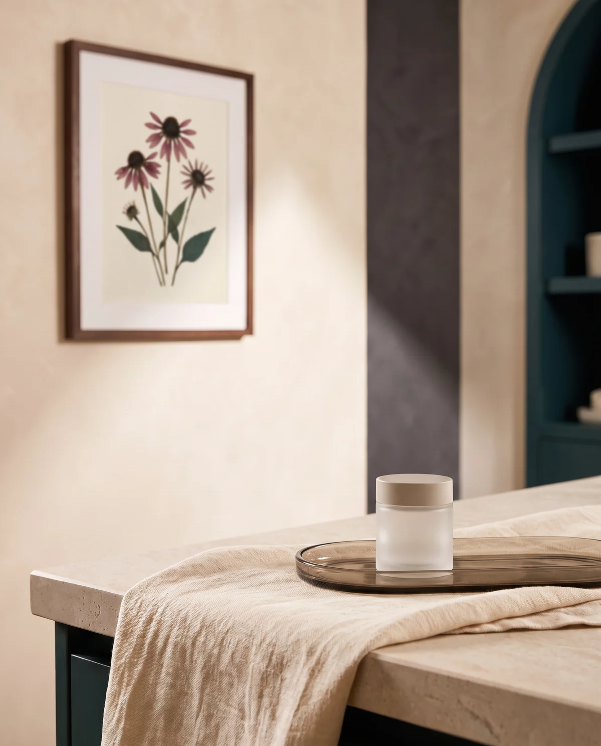 Backroads Beauty treatment room with pressed echinacea artwork and a skincare jar arranged in warm natural light